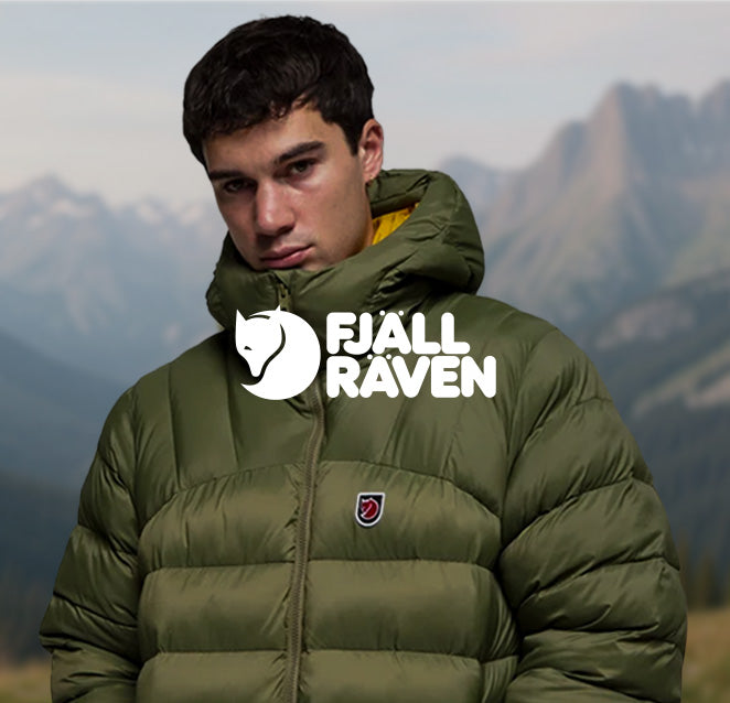Person wearing an olive-green Fjällräven insulated down jacket against a mountain backdrop, with Fjällräven branding displayed across the image.
